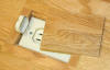 Electrical outlet cover for wood floors